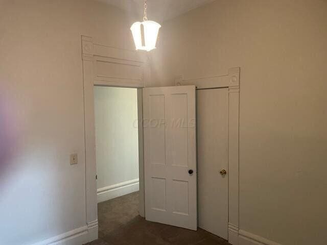 unfurnished bedroom with baseboards