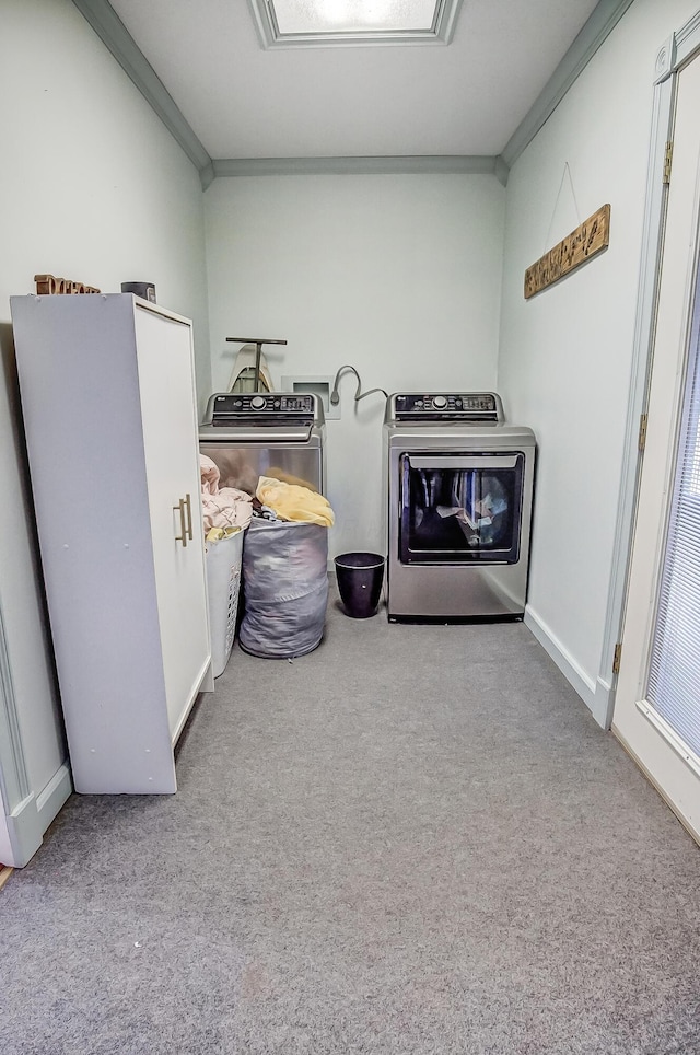 laundry area featuring laundry area, carpet, baseboards, and crown molding