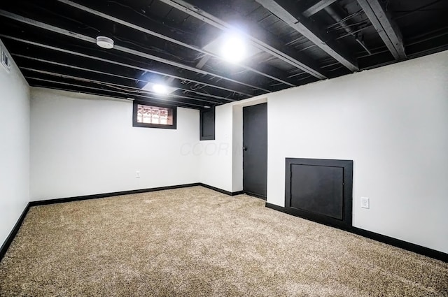 basement with carpet and baseboards