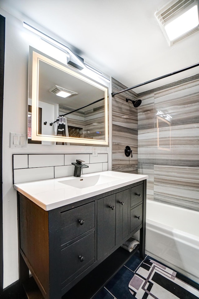 full bath with tile patterned flooring, visible vents, vanity, decorative backsplash, and shower / bath combo with shower curtain