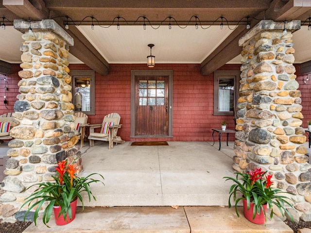 doorway to property with covered porch