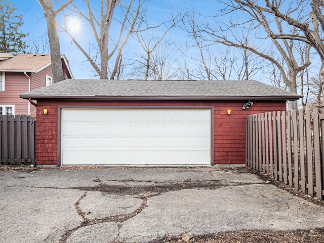 detached garage with fence