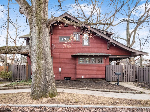 view of front of house featuring fence