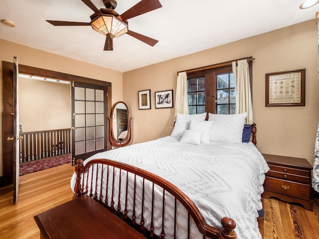 bedroom with wood finished floors and a ceiling fan