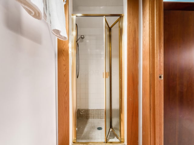 full bath featuring a shower stall