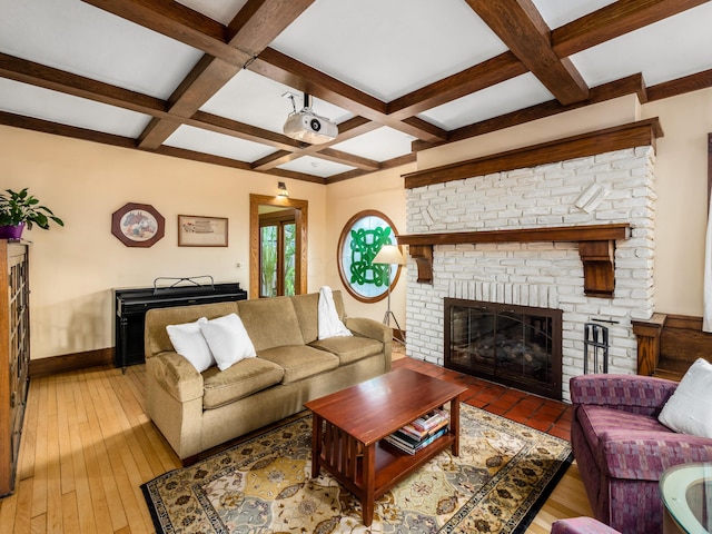 living area featuring wood-type flooring, a fireplace, baseboards, and coffered ceiling