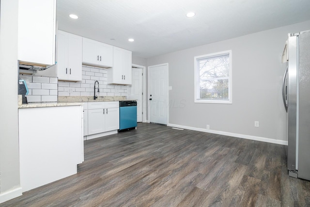 kitchen with dark wood finished floors, tasteful backsplash, freestanding refrigerator, white cabinetry, and dishwashing machine