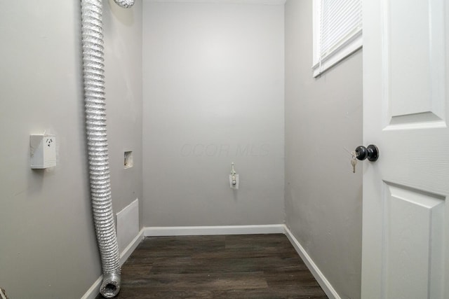 laundry area with baseboards, dark wood-type flooring, and hookup for an electric dryer