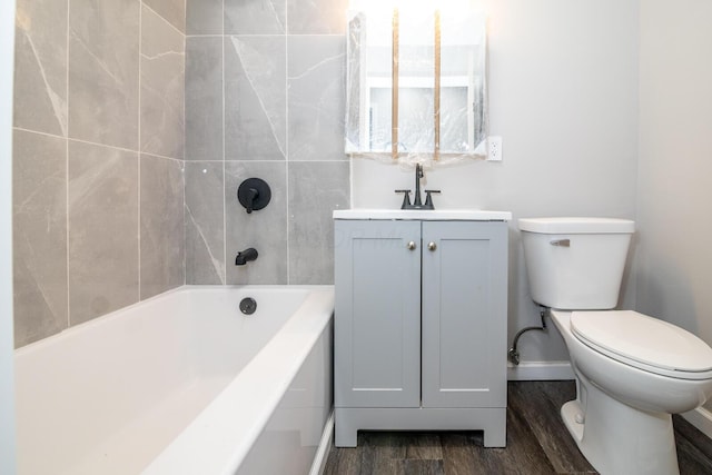 full bathroom with baseboards, vanity, toilet, and wood finished floors