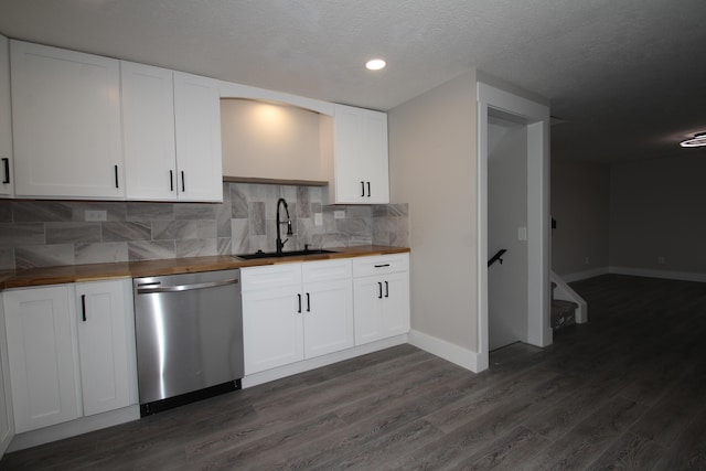 kitchen featuring dark wood-style floors, dishwasher, a sink, and wooden counters