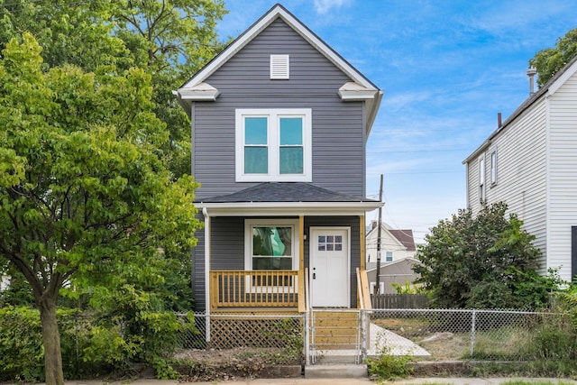 view of front of house with covered porch and a fenced front yard