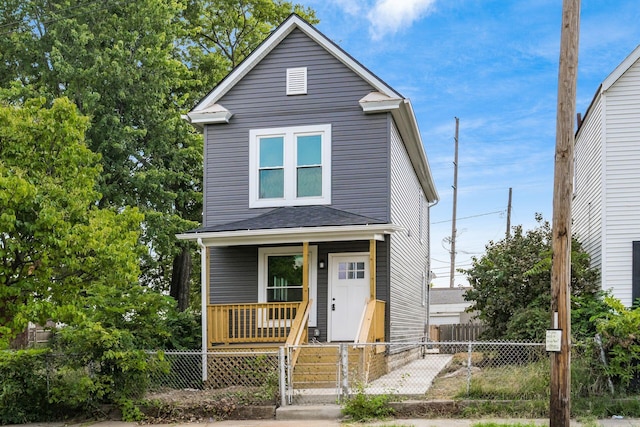 view of front of property with a porch, a gate, and a fenced front yard