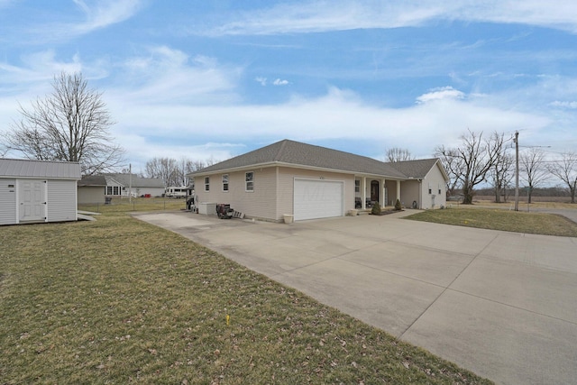 view of side of property featuring a yard, an attached garage, and driveway