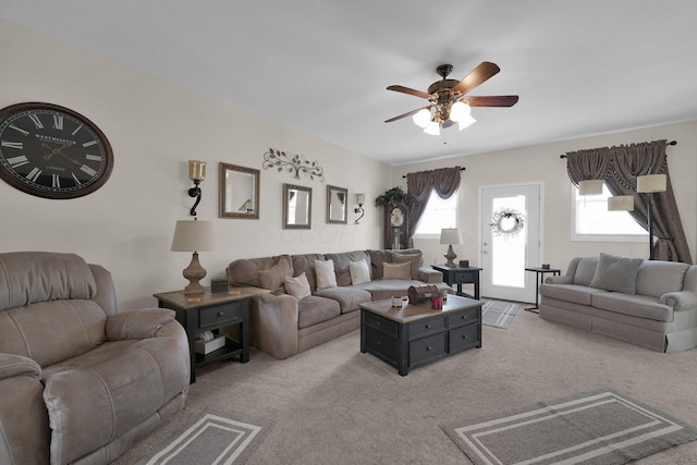 living room with light carpet and ceiling fan