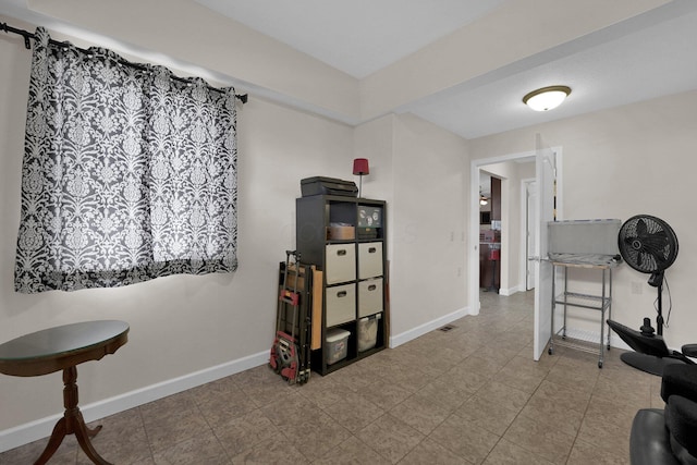 workout room with baseboards
