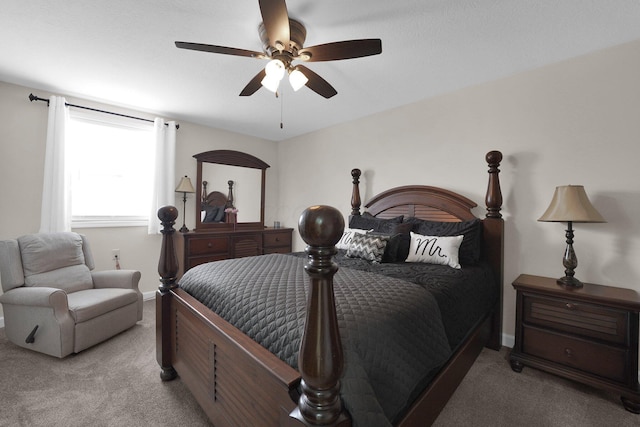 carpeted bedroom featuring a ceiling fan and baseboards
