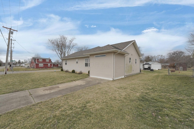 view of property exterior with a yard