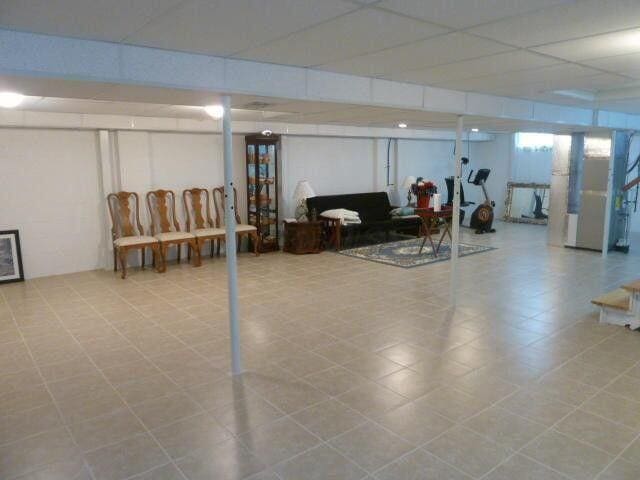 below grade area with a drop ceiling