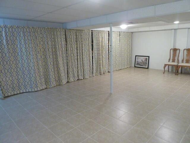 finished below grade area with a drop ceiling