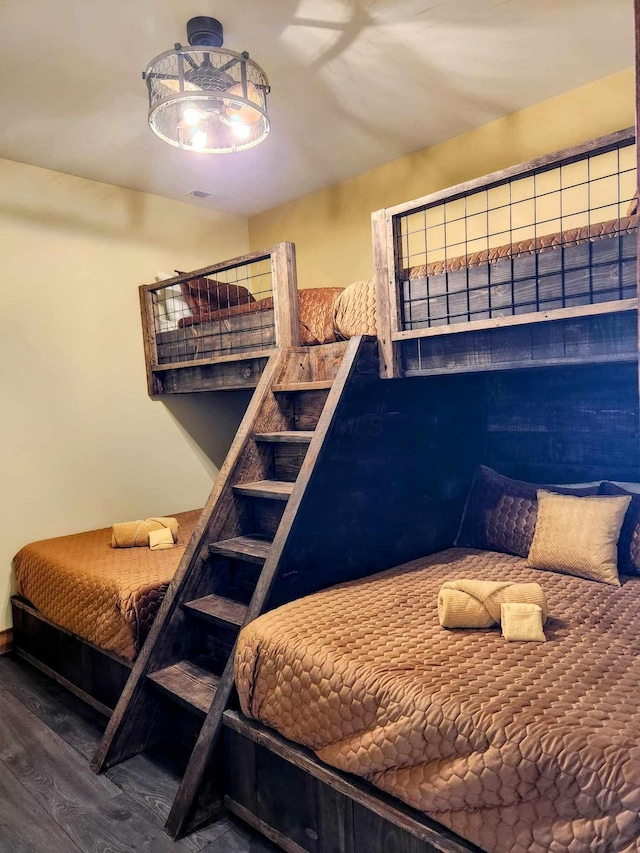 bedroom with wood finished floors