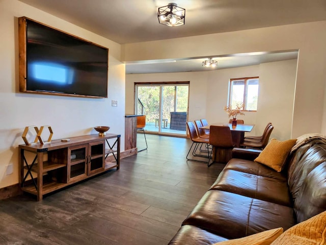 living area with dark wood finished floors and baseboards