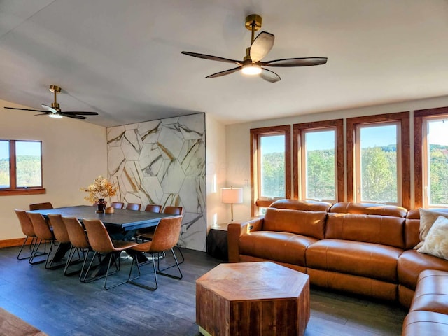 living room with dark wood-style flooring, plenty of natural light, and ceiling fan