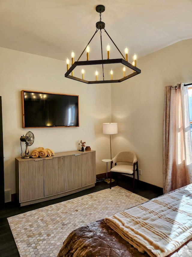 bedroom with baseboards and visible vents