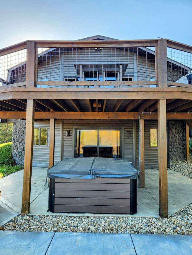 exterior space with a hot tub