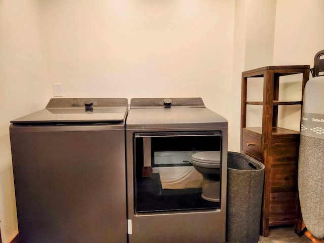 laundry area with washing machine and dryer and laundry area