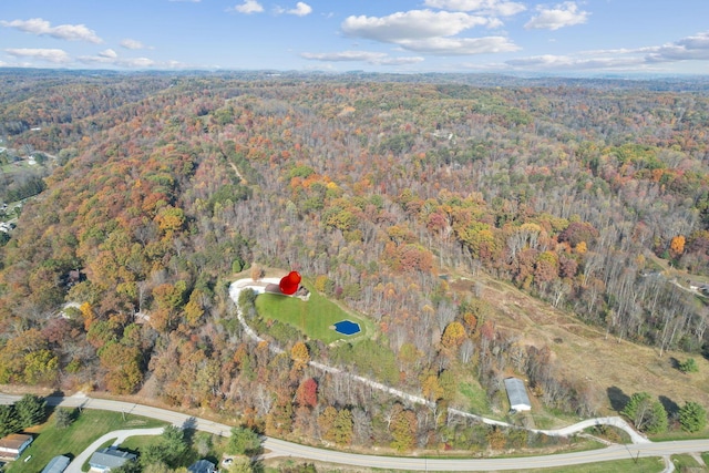 aerial view featuring a view of trees