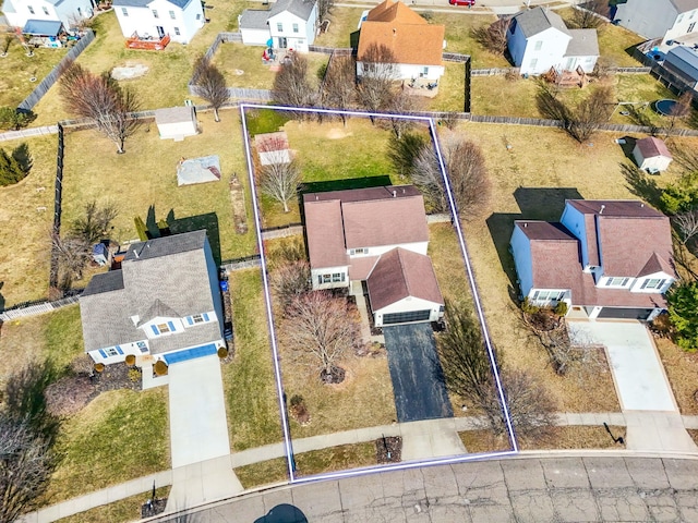 birds eye view of property with a residential view