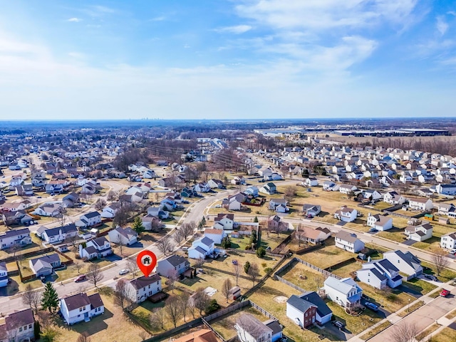 birds eye view of property with a residential view