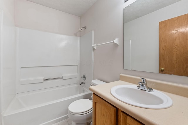 bathroom featuring a textured ceiling,  shower combination, vanity, and toilet