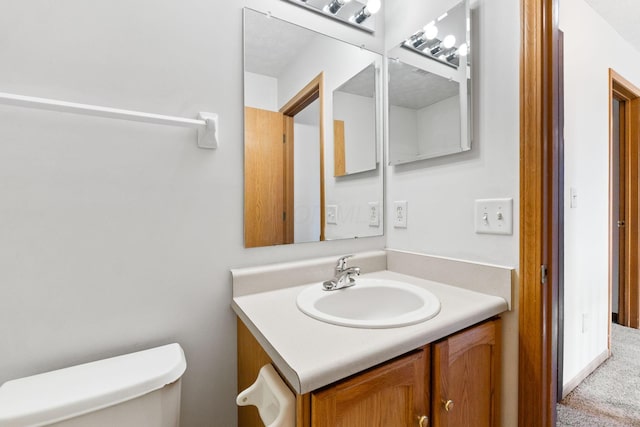 half bath with vanity and toilet