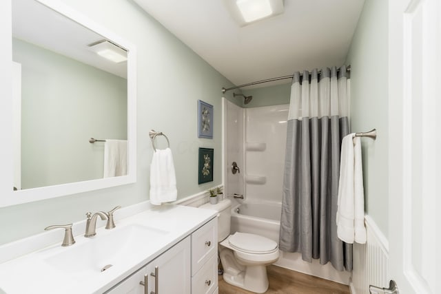 full bath with vanity, wood finished floors, toilet, and shower / bathtub combination with curtain