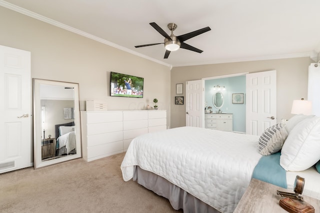 carpeted bedroom featuring crown molding, visible vents, ensuite bathroom, and ceiling fan