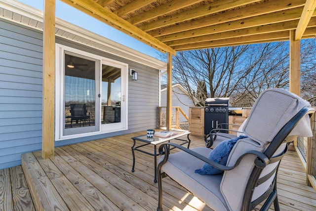 wooden deck featuring area for grilling