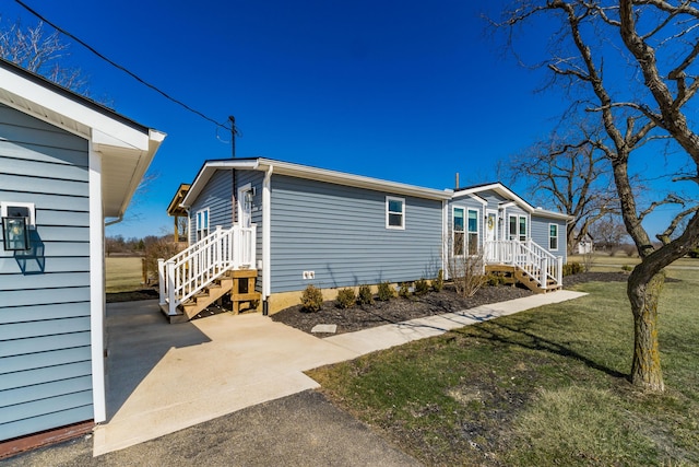 exterior space with a lawn and driveway