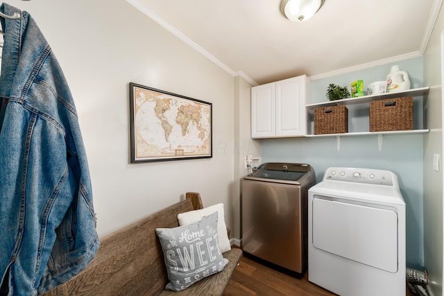 clothes washing area featuring dark wood finished floors, cabinet space, independent washer and dryer, and ornamental molding