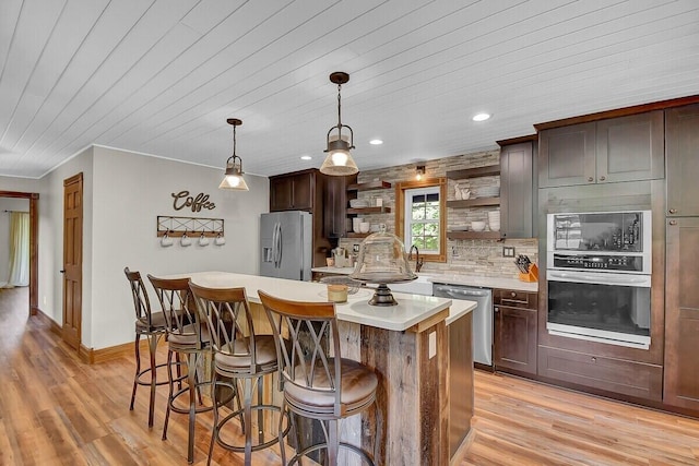 kitchen with tasteful backsplash, stainless steel appliances, light countertops, light wood-type flooring, and open shelves