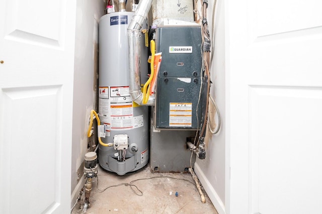 utility room featuring water heater