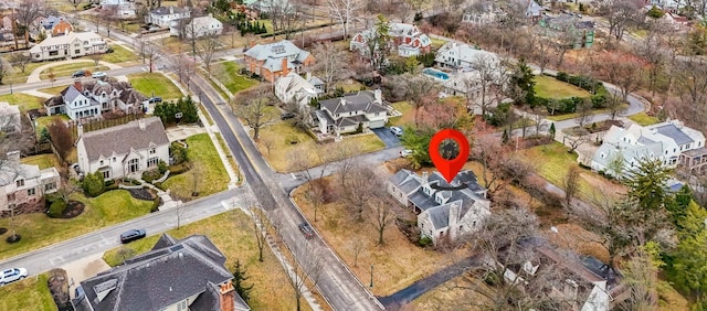 birds eye view of property with a residential view