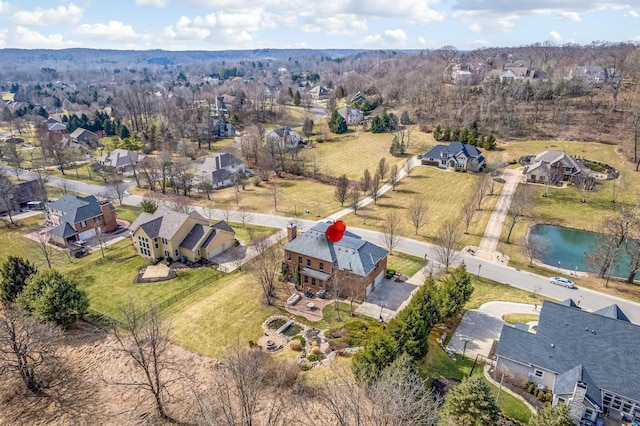 bird's eye view with a water view and a residential view