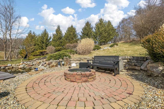 view of patio / terrace featuring a fire pit