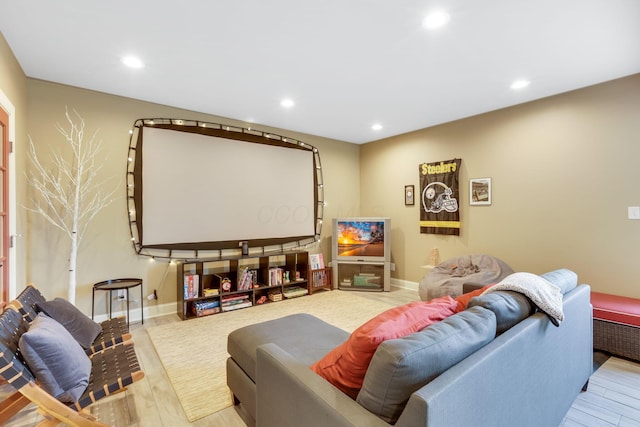 home theater room featuring wood finished floors and recessed lighting