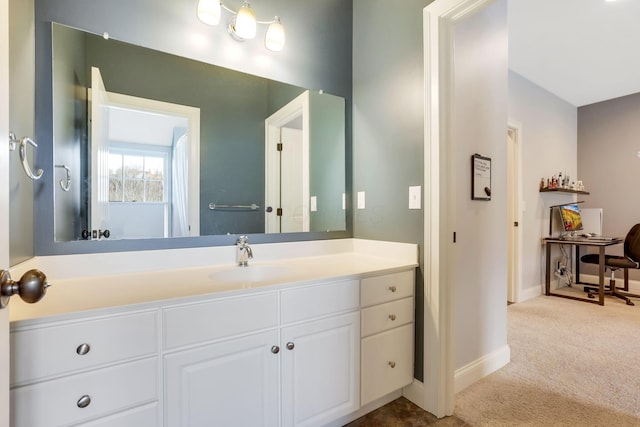 bathroom featuring vanity and baseboards