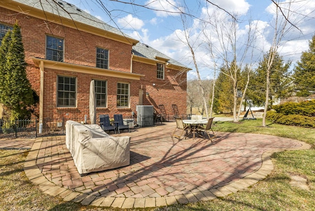 view of patio with fence and central AC