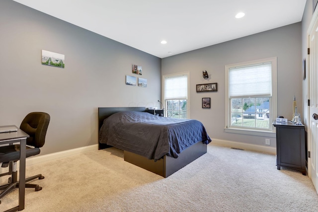 carpeted bedroom featuring recessed lighting, visible vents, and baseboards