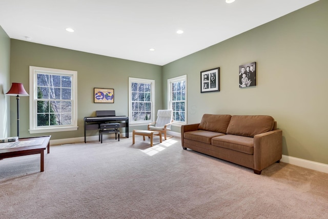 carpeted living room featuring baseboards and recessed lighting