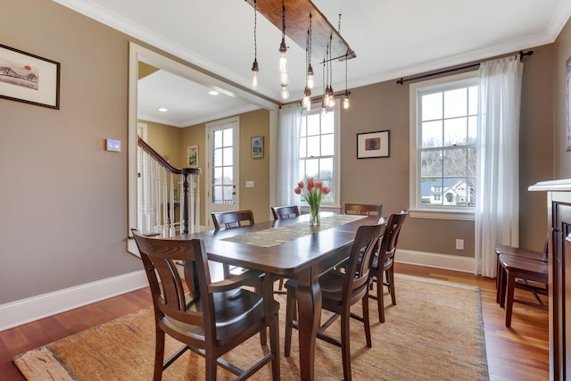 dining room with baseboards, stairway, crown molding, light wood-style floors, and recessed lighting